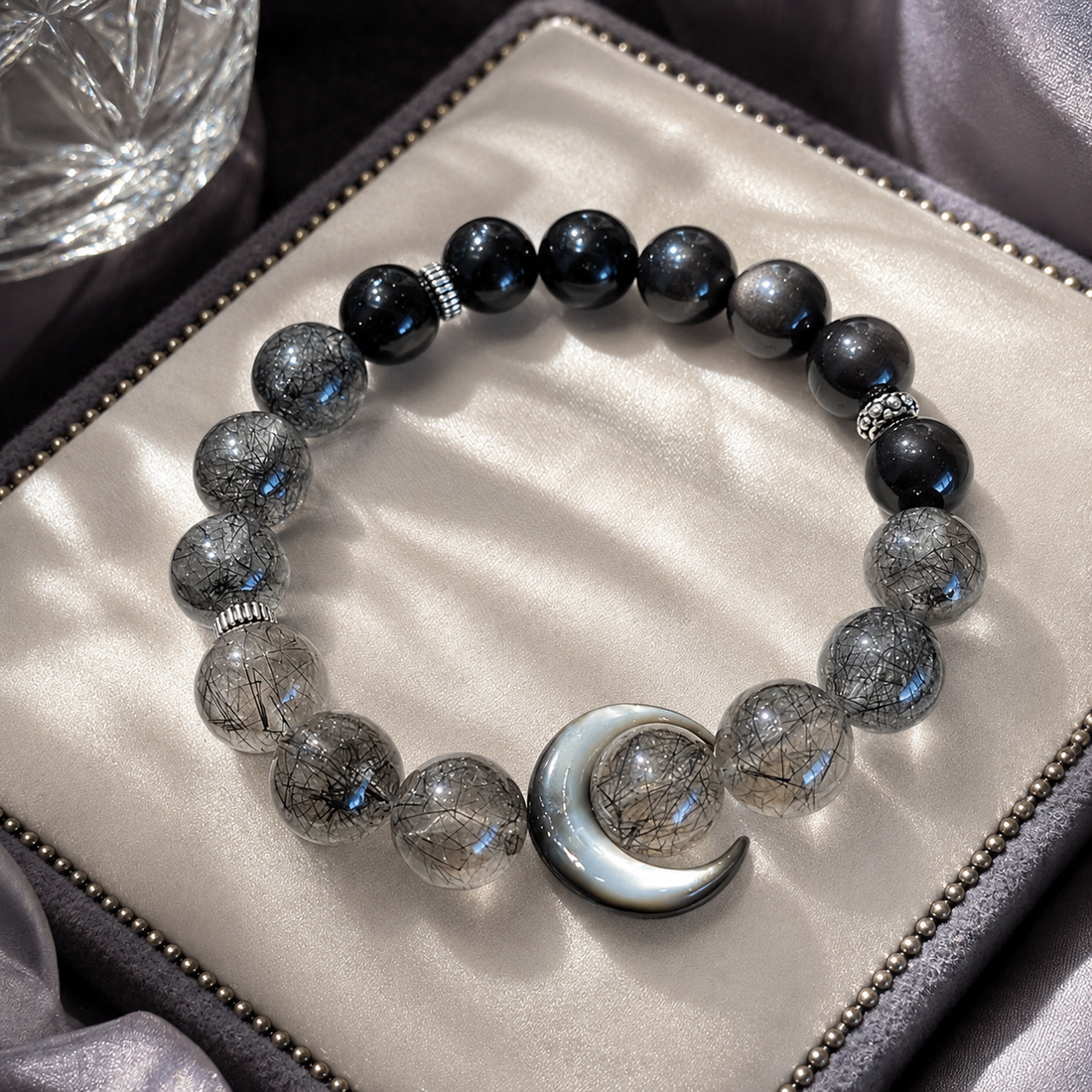 Black Hair Crystal Moon Bracelet worn on wrist showing daily protection ritual practice with dark crystal beads and moon charm